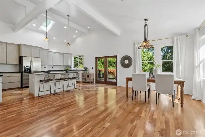 Kitchen & Dining areas, eating island, Hardword & tile floors, vaulted ceilings, French doors to 2nd deck, skylights