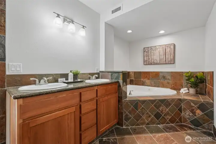 Primary Suite Bathroom, jetted soaking tub, tile floors, WI shower