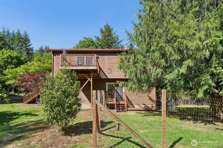 Back of home, two decks, fenced yard