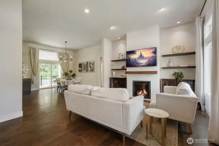 Floating shelves flank the fireplace & TV focal point.