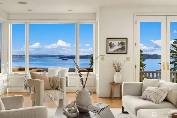 ... through walls of picture windows and French doors.