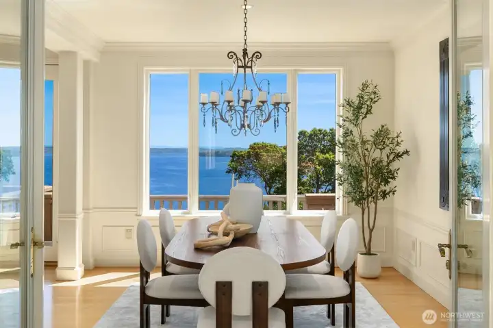 The dining room flows from the water/mountain views and the interior courtyard with its refreshing fountain.