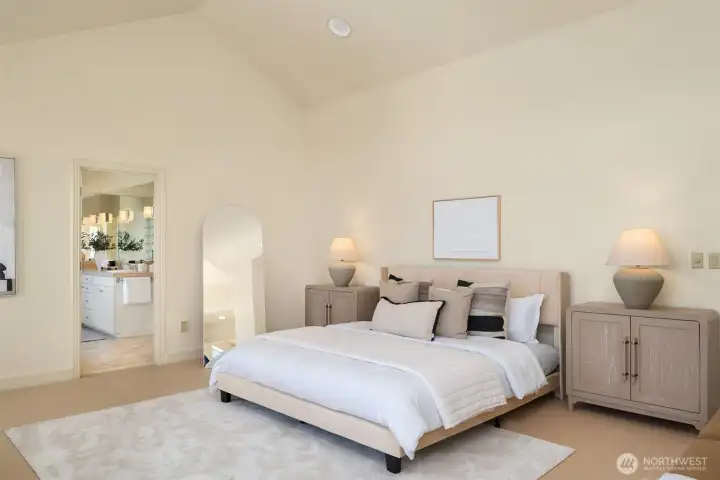 The primary ensuite enjoys vaulted ceilings and plenty of space for all your favorite pieces.