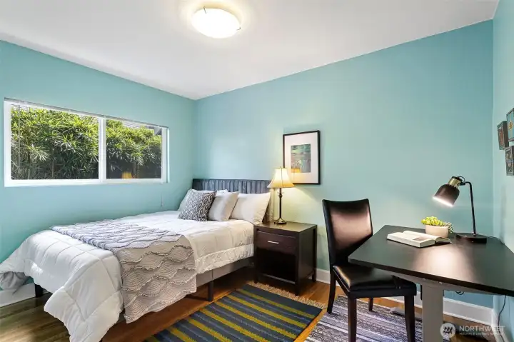 The first of two main level bedrooms, this one is quiet and comfortable with pleasant greenery framed in the window. The first of two main level bedrooms, this one is quiet and comfortable with pleasant greenery framed in the window.