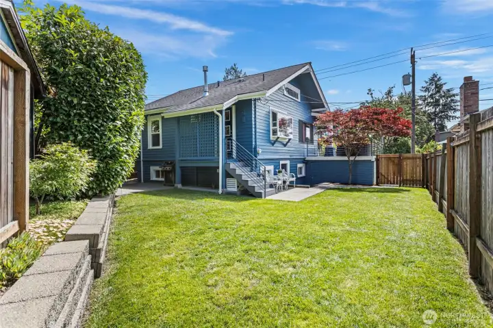 A level backyard with lush grass, full privacy from mature hedging and fencing, and plenty of room to enjoy the outdoors. A level backyard with lush grass, full privacy from mature hedging and fencing, and plenty of room to enjoy the outdoors.