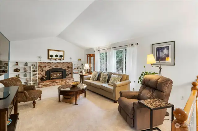 Spacious Living room area on main floor with gas fireplace insert.