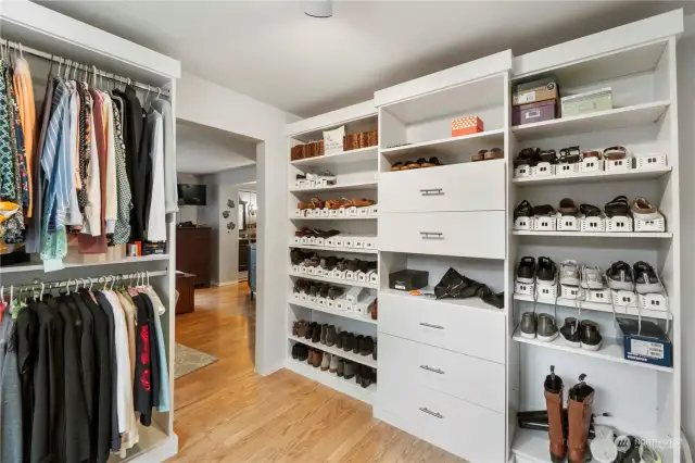 Main Bedroom Walk in closet with custom shelving and cabinetry.