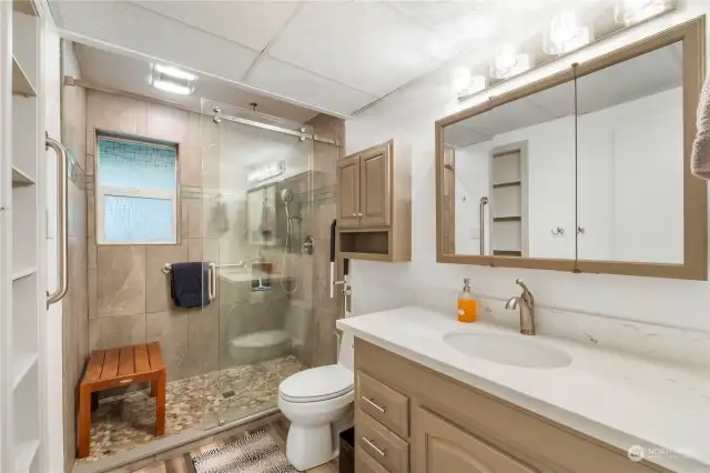 Beautifully modernized and appointed 3/4 bathroom on lower level.