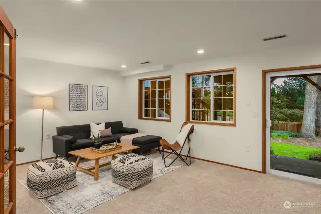 Large rec room downstairs with sliding glass door to patio.