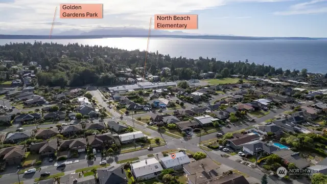 Drone shot showing proximity to North Beach Elementary School and Golden Gardens Park. Home is marked at the bottom of photo with a red dot.