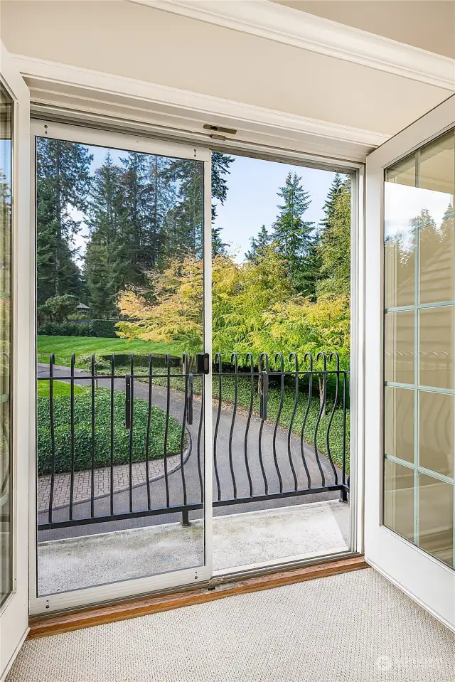 This bedroom balcony offers southern exposure and views of the front yard.