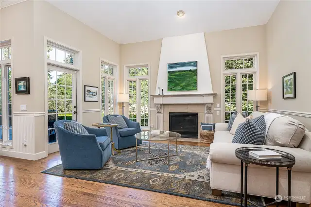 The living room off the kitchen and an eating nook is cozy and bright with lots of windows.