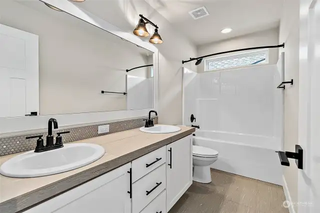 Upstairs guest bath with dual vanity photos for representative purposes only