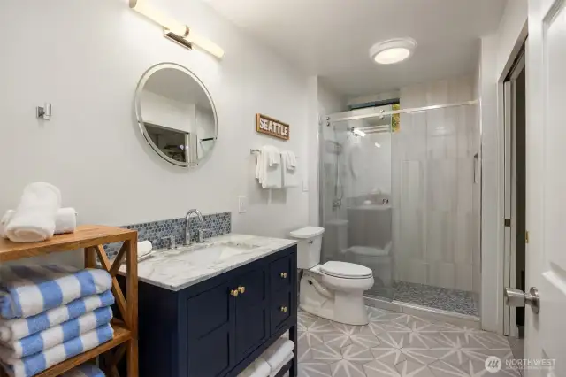 3/4 bath in the lower level with laundry.  (washer and dryer do not convey)