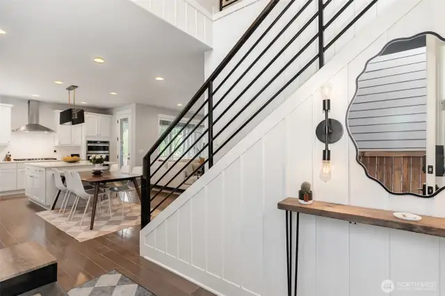 Entry w/  horizonal metal stair railings