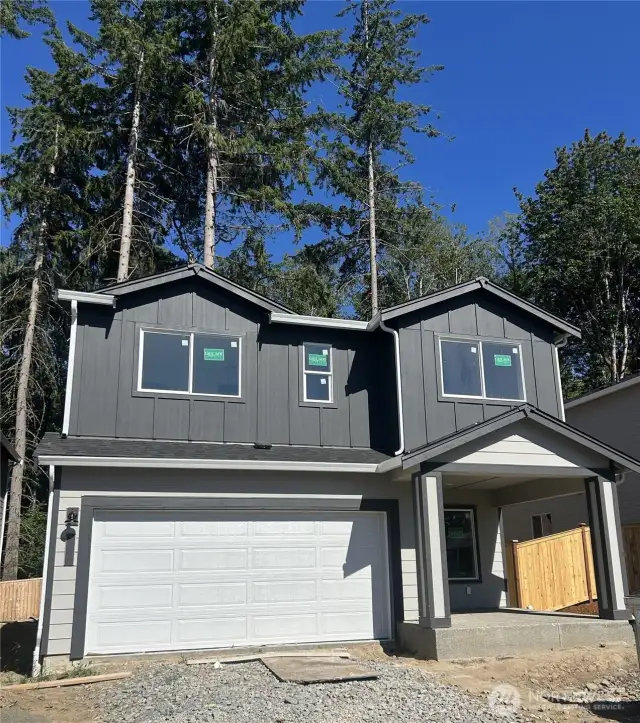 Home under construction; front and rear landscaping is included.