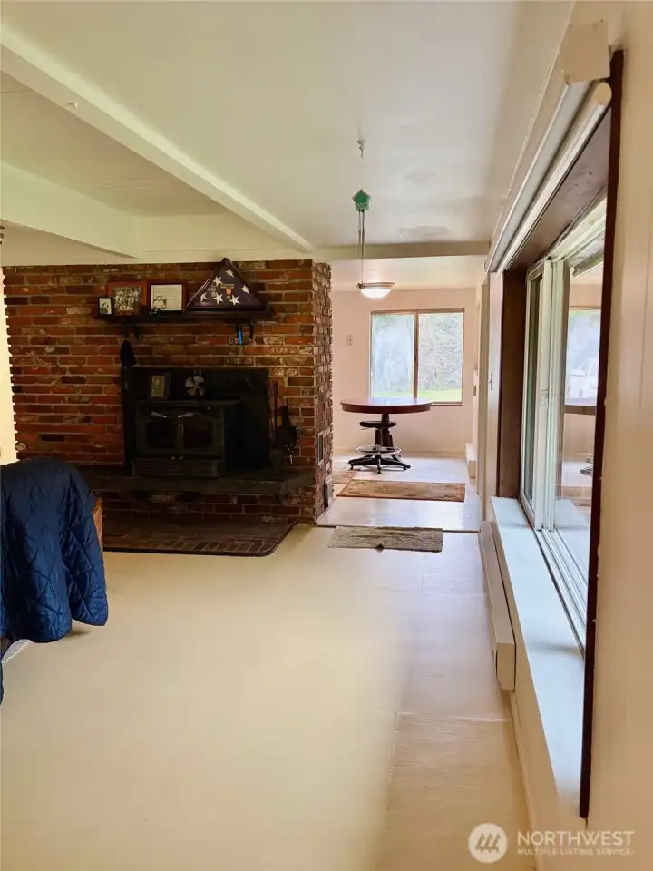 View from Far Wall of Living Room Towards Kitchen