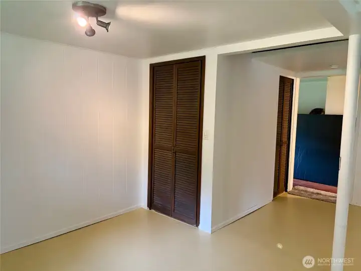 Far Wall of Living Room Features a Spacious CLoset
