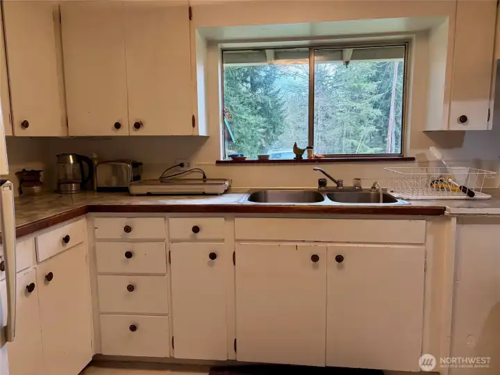 Kitchen with window overlooking the cottage