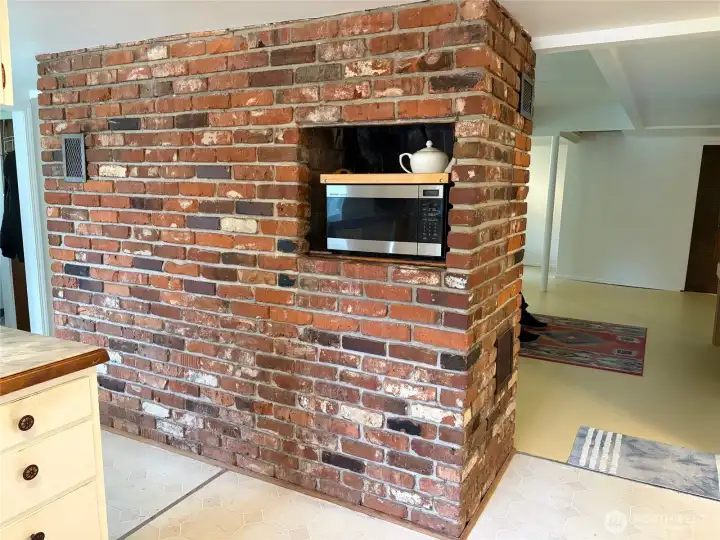 The back side of the fireplace which is the perfect spot for a microwave!