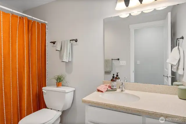 Shared full bath in hallway.