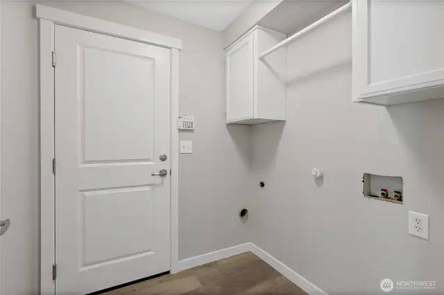 Laundry room newer washer and dryer are being stored in garage for flooring replacement