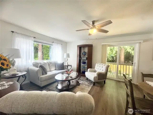 Living room features sliding doors that open to a spacious deck.