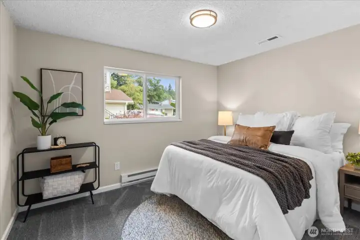 Bedroom 3 offers BRAND NEW CARPET and even more natural light out the window on the North side of the home!