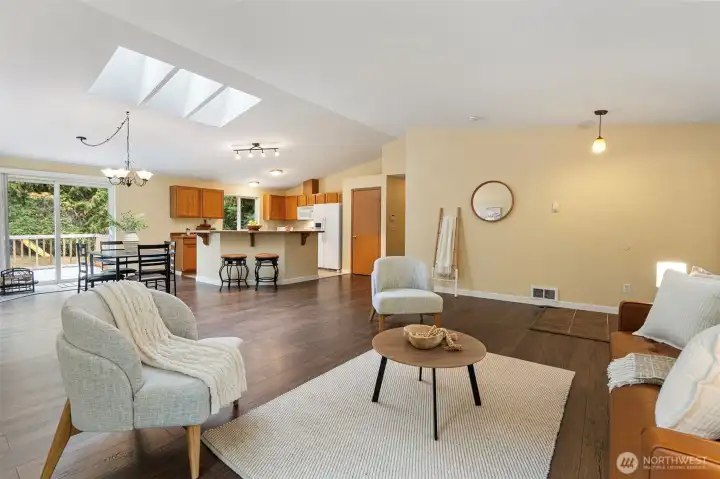 Tall ceilings with skylights in this great room for all to enjoy.