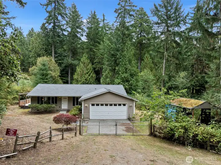 Gated to a two car attached garage.