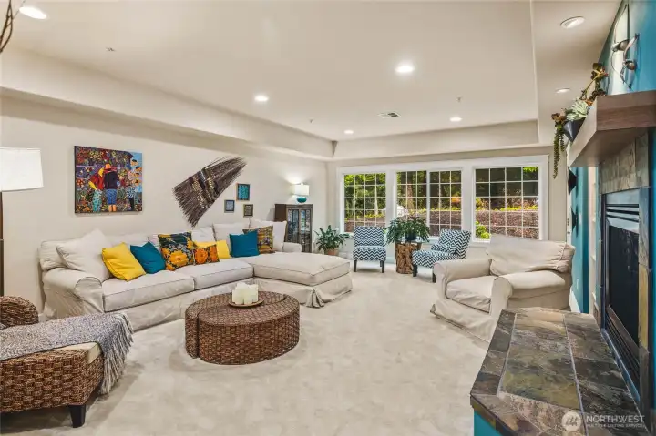 Windows from Living Area Overlook Forested Back Yard