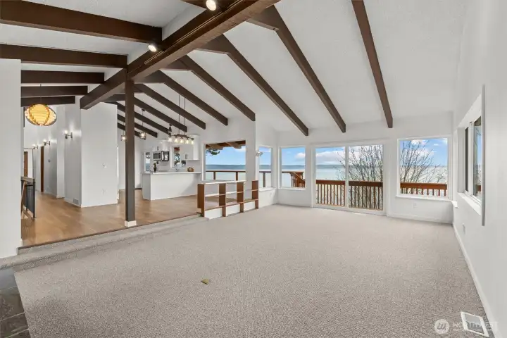 Upper livingroom with soaring high vaulted ceilings