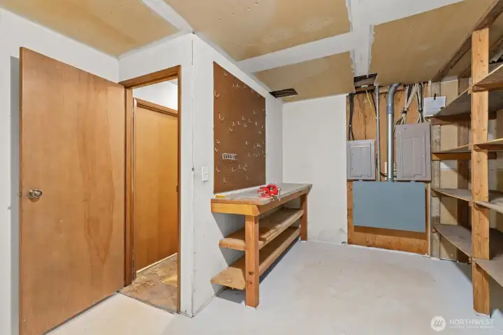 Huge workshop at bottom of stairs.