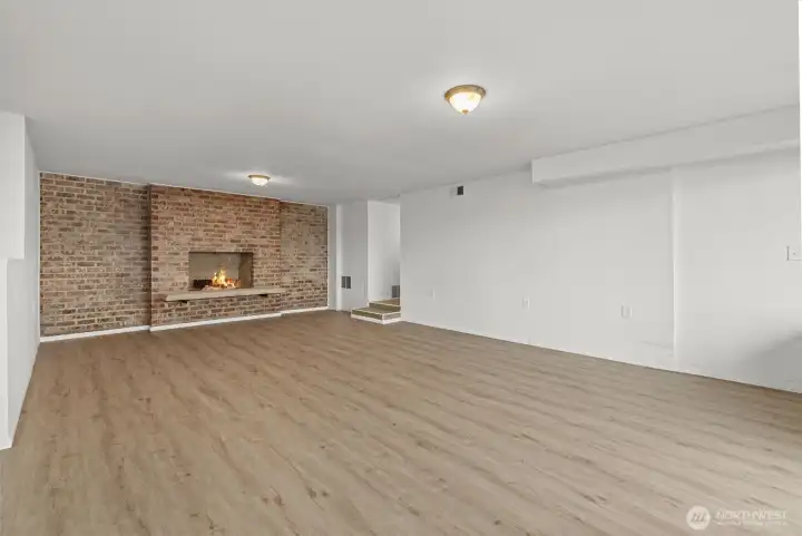 Recroom with wood burning fireplace.