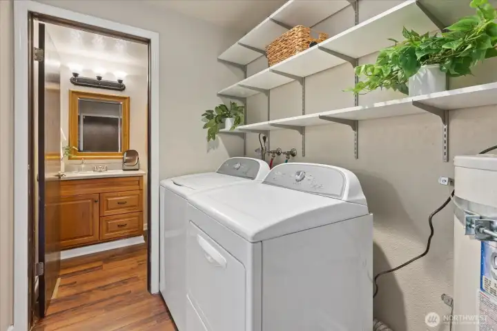 Utility room and guest bathroom. Appliances will stay.