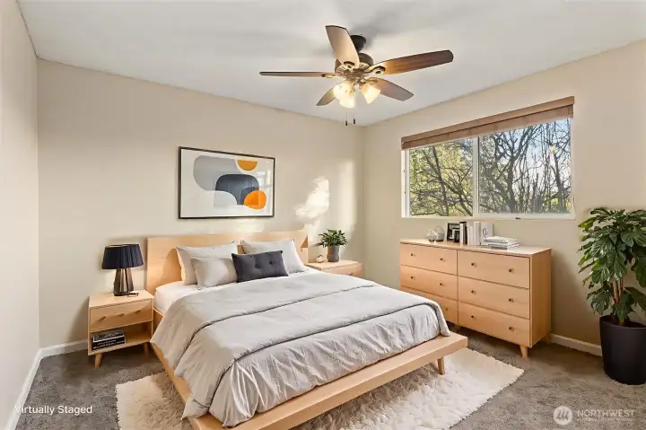 Bedroom #2, east-facing with updated ceiling fan and light fixture.