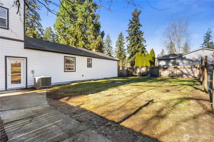 Portion of back yard is ready for final touches to be fully fenced in.\