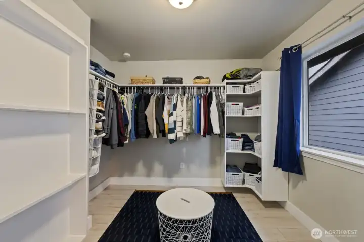 Dreamy oversized and well-appointed walk-in closet!