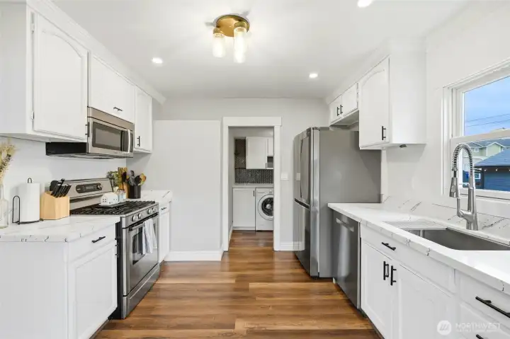 Quartz countertops, new stainless steel appliances, light fixture