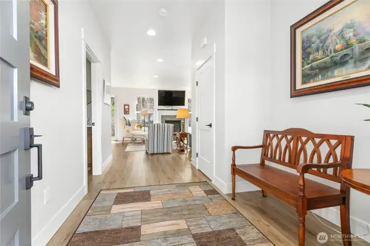 Step inside to a welcoming foyer—perfect for greeting guests and giving them a comfortable place to kick off their shoes, all before entering the main living space. A thoughtful touch that offers much more privacy than walking straight into the living room!