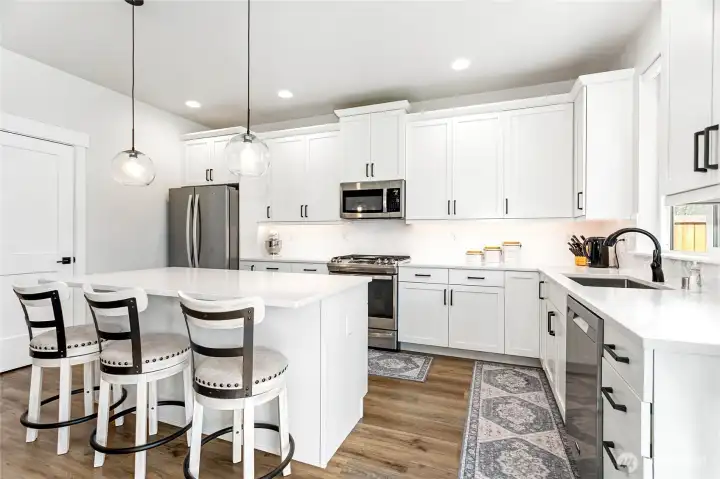 This kitchen truly shines—bright, modern, and loaded with features that make cooking and entertaining a joy!