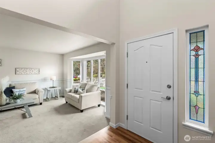 Enter front door into high ceilings and natural light.