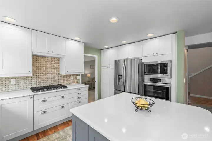Large island and plenty of counter space in the remodeled kitchen.
