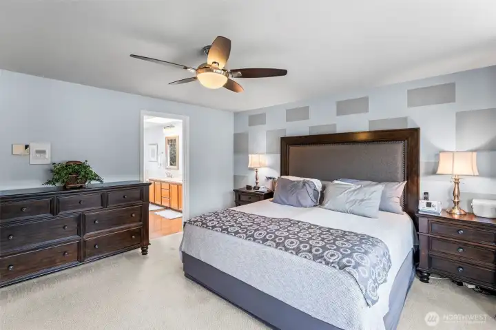 Primary Bedroom with 5-piece ensuite bathroom & walk-in closet.