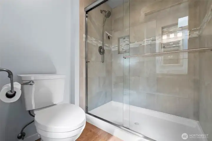 Private water closet & walk-in shower in Primary Bathroom.