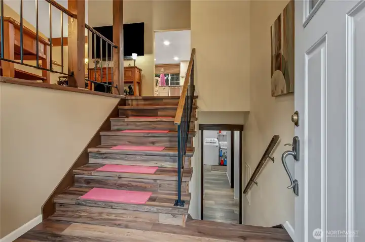 Newer LPV flooring on stairs and main living area.  Stairs are nice and wide and open to living space upstairs.