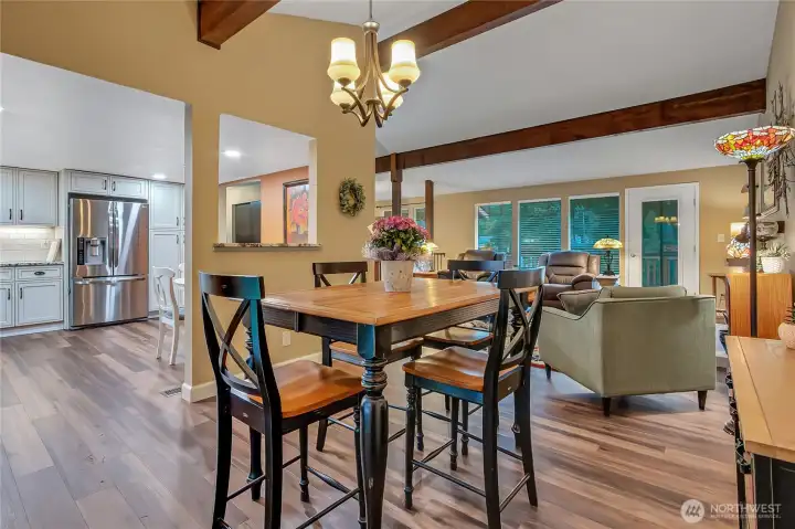 Kitchen from dining room.  Newer LPV flooring and custom paint make this space warm and inviting.