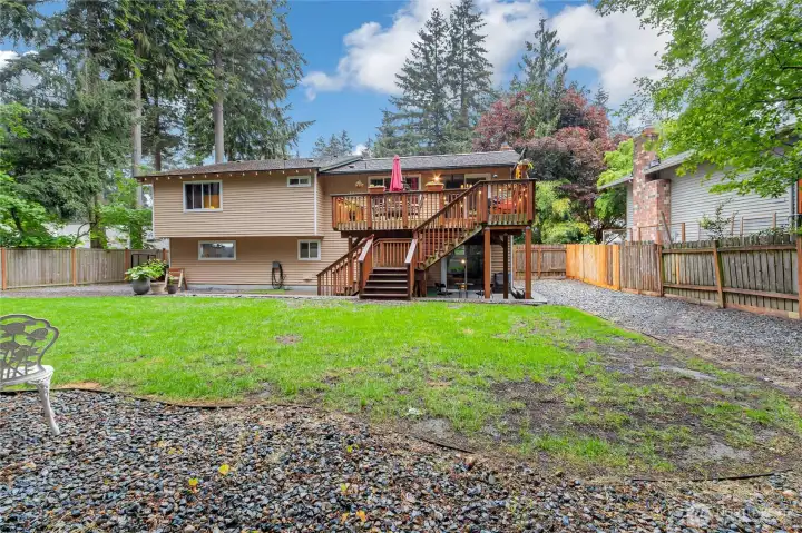 Backyard is spacious and offers plenty of room for entertaining and relaxing.