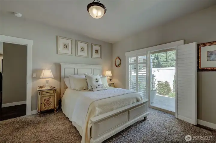 Primary bedroom with doors to the backyard!