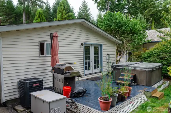 BACK OF HOME WITH DECK AND TUB